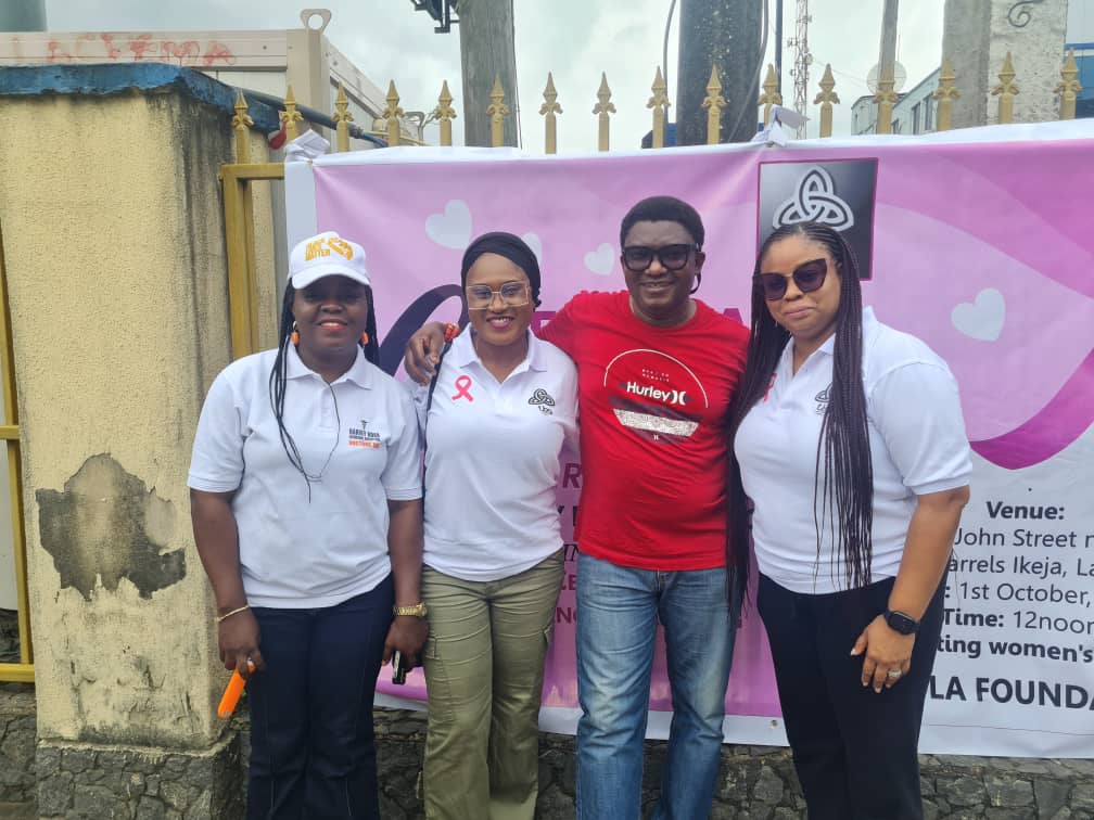 Kajola Foundation team in front of the women's health screening banner