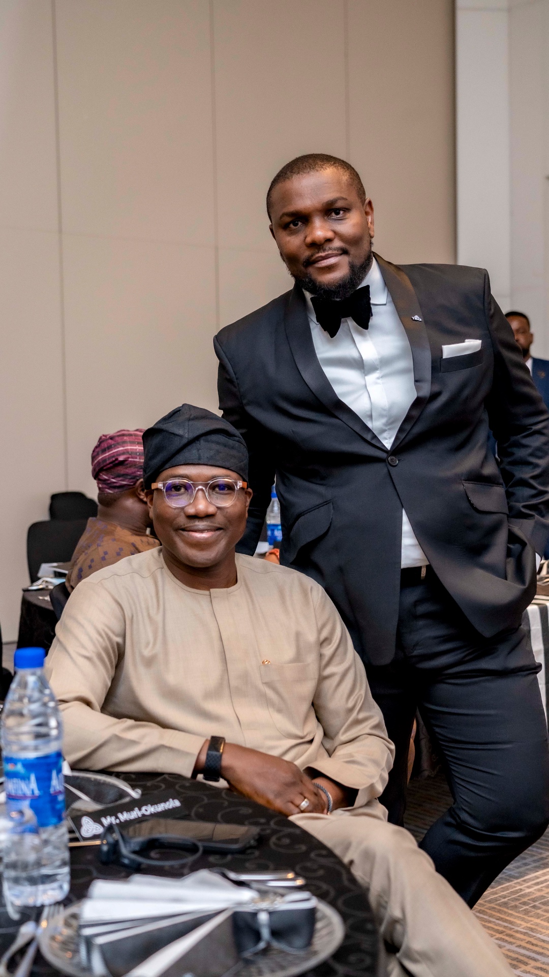 TBG member with a seated guest at the Founders Day dinner